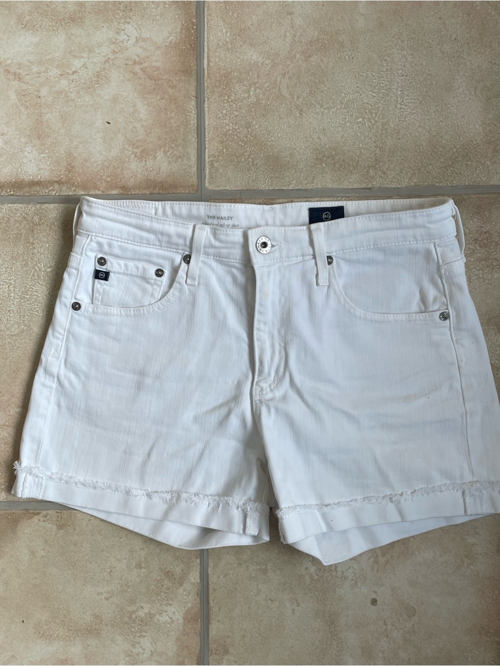 AG Adriano Goldschmied The Hailey mid rise white cuffed denim shorts; 26R